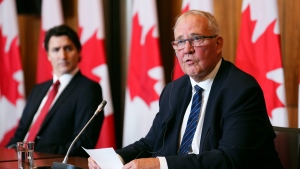 Prime Minister Justin Trudeau looks on as Emergency Preparedness Minister Bill Blair speaks at a press conference, in Ottawa, Monday, June 5, 2023. THE CANADIAN PRESS/Sean Kilpatrick