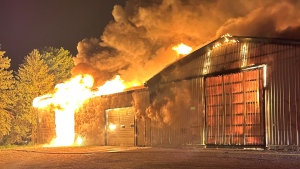 A fire consumes a structure in Mount Forest on June 4. (Minto Fire/Submitted)