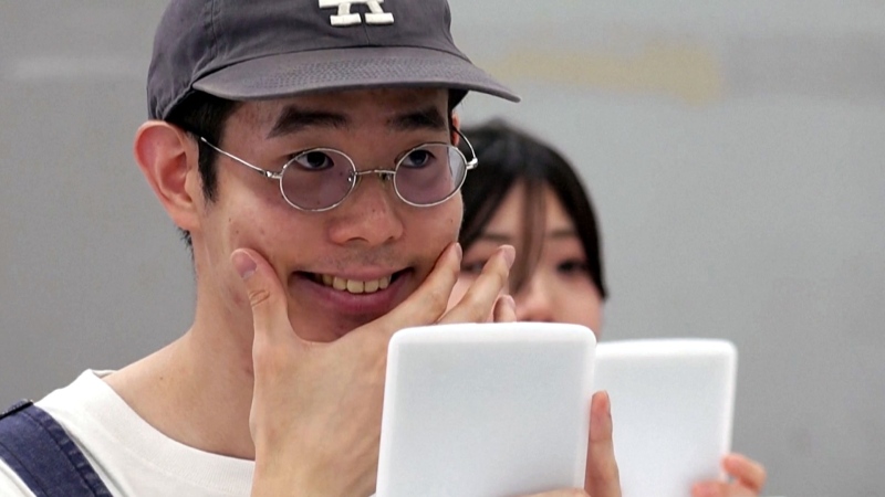 Japanese students learn how to smile again