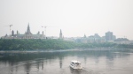 Downtown Ottawa is seen engulfed in wildfire smoke, Monday, June 5, 2023. According to Environment Canada a special air quality statement has been issued as a result of local forest fires in Quebec with poor air quality persisting throughout the day and possibly into Tuesday. (Spencer Colby/THE CANADIAN PRESS)
