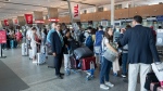 Passengers at the Montreal airport. FILE - THE CANADIAN PRESS/Ryan Remiorz