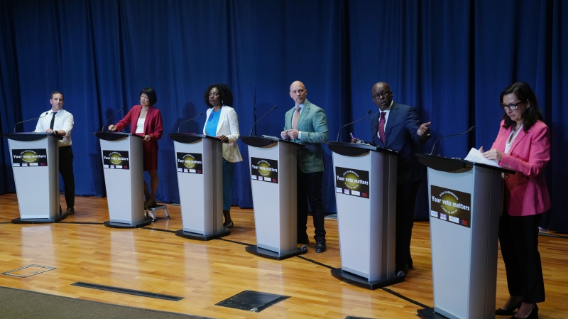 Toronto mayoral candidates Josh Matlow, left to right, Olivia Chow, Mitzie Hunter, Brad Bradford, Mark Saunders and Ana Bailao take the stage at a mayoral debate in Scarborough, Ont. on Wednesday, May 24, 2023.THE CANADIAN PRESS/Chris Young