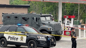 Quebec police officers working out of the provincial organized crime-fighting squad made concurrent raids in Kanesatake and St. Jerome on June 6, 2023.