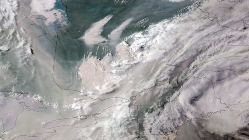 In this GOES-16 GeoColor satellite image taken Monday, June 5, 2023 at 7 p.m. EDT and provided by CIRA/NOAA, smoke from wildfires burning in Quebec, Canada, top center, drifts southward. (CIRA/NOAA via AP)