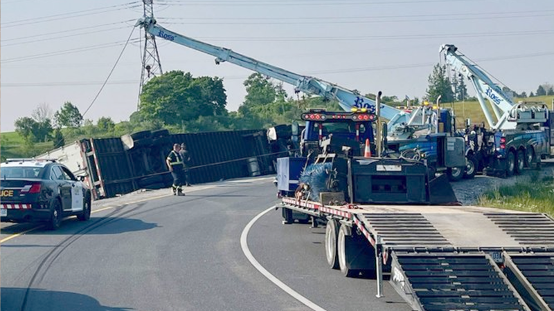 A tractor-trailer rolled over on Highway 401 in Thames Centre on June 6, 2023. (Source: OPP/Twitter)