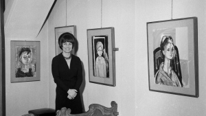Artist Francois Gilot poses with her work at a personal art exhibition in Milan, Dec. 21, 1965. (AP Photo, File)