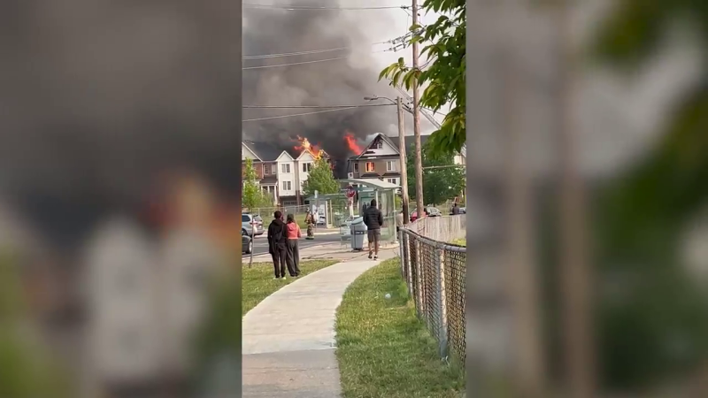Crews battle a fire at a townhouse complex in North York.