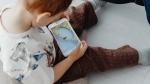 Parents can serve as positive role models for their children when it comes to handling social media use, one expert says. (Pexels)