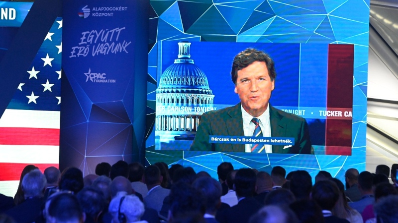 Tucker Carlson appears on screen at the Hungary Conservative Political Action Conference in Budapest, on May 4, 2023. (Szilard Koszticsak / MTI via AP) 