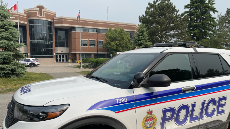 Ottawa police cruisers parked outside Holy Trinity Catholic High School in Kanata. The school says the front office received an anonymous call about someone with a weapon inside the school Wednesday morning. (Dave Charbonneau/CTV News Ottawa)