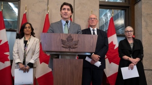 Prime Minister Justin Trudeau and Emergency Preparedness Minister Bill Blair listen to a question during a news conference about forest fires, in Ottawa, Wednesday, June 7, 2023. THE CANADIAN PRESS/Adrian Wyld