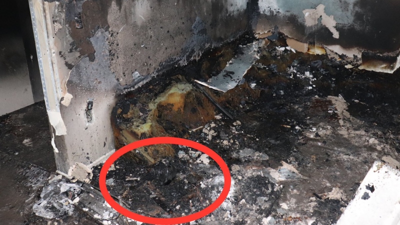A photo from the scene of a fire in a row house on Craig Henry Drive. The circled area shows where an air purifier was before it caught fire. June 6, 2023. (Ottawa Fire Service/Twitter)