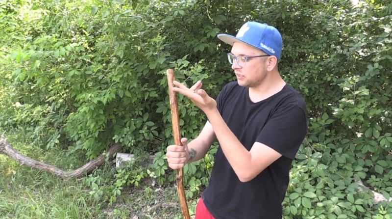 Shawn Mitchell shows off his hand-made walking stick ahead of leading a spiritual walk in London, Ont. on June 7, 2023. (Daryl Newcombe/CTV News London)
