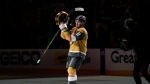 Vegas Golden Knights defenseman Zach Whitecloud (2) acknowledges the fans after Game 1 of the NHL hockey Stanley Cup Finals against the Florida Panthers, Saturday, June 3, 2023, in Las Vegas. The Golden Knights defeated the Panthers 5-2. (AP Photo/John Locher)