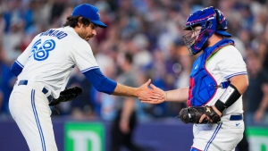 Toronto Blue Jays relief pitcher Jordan Romano (68), left, celebrates with teammate catcher Alejandro Kirk (30) after defeating the Houston Astros in American League MLB baseball action in Toronto on Wednesday, June 7, 2023. THE CANADIAN PRESS/Andrew Lahodynskyj