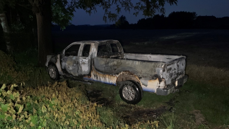 A pickup truck went off the road and up in flames around 9 p.m. on June 7, 2023 on Deadmans Road near Westdel Bourne. (Bryan Bicknell/CTV News London)