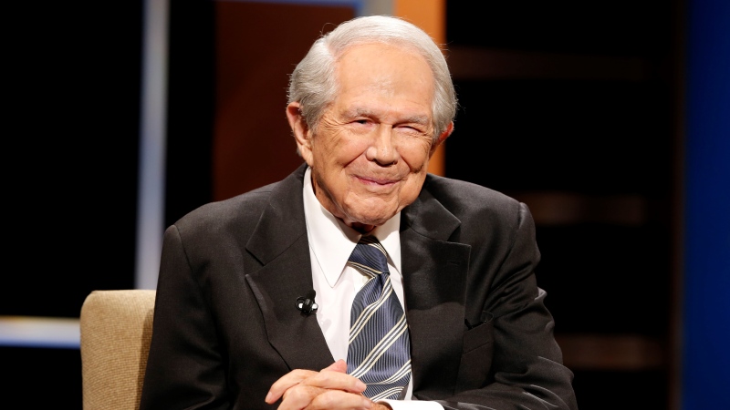Rev. Pat Robertson poses a question to a Republican presidential candidate during a forum at Regent University in Virginia Beach, Va., Oct. 23, 2015. (AP Photo/Steve Helber, File)