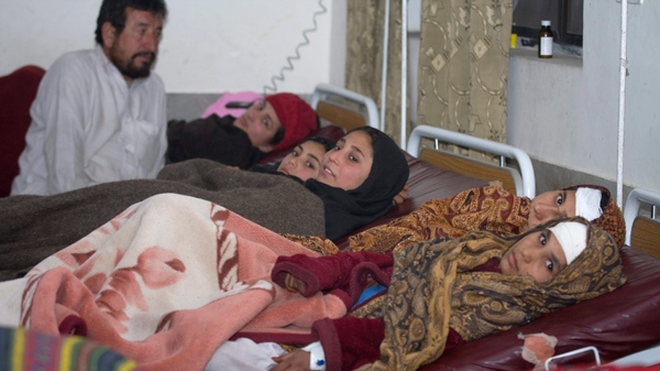 Pakistani students injured in a blast that also killed 3 U.S. soldiers are seen at a local hospital in Timargrah, the main town of the Lower Dir district, Pakistan, Wednesday, Feb. 3, 2010. (AP / Anjum Naveed)