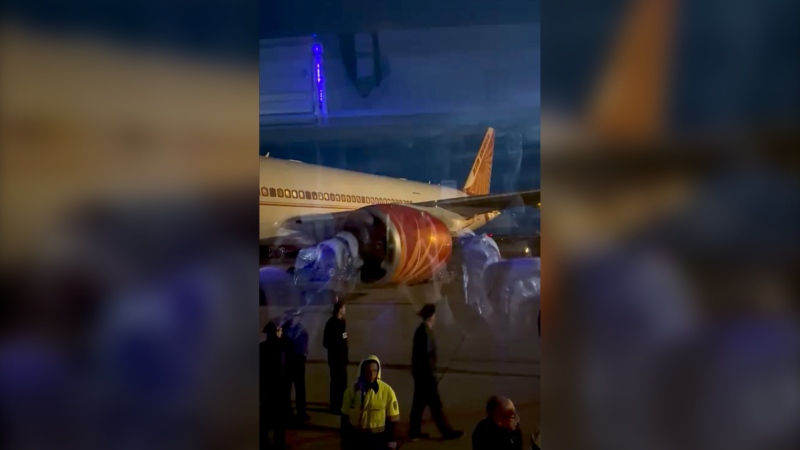 This image from video provided by passenger Girvaan Singh Kahma shows Air India's Boeing 777 after it landed at Russia's Magadan airport in Siberia on June 6, 2023.  (Girvaan Singh Kahma via AP) 