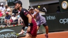 Canada's Bianca Andreescu, rear, and New Zealand's Michael Venus play a shot against Japan's Miyu Kato and Germany's Tim Puetz during their mixed doubles final match of the French Open tennis tournament at the Roland Garros stadium in Paris, Thursday, June 8, 2023. (AP Photo/Thibault Camus)