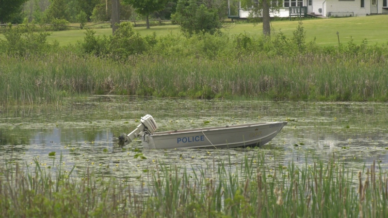 An OPP boat in the water near Cornelia Street West in Smiths Falls on Thursday. (Nate Vandermeer/CTV News Ottawa)