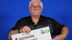John Hamilton, of Hamilton, Ont., with his Lotto Max prize. (OLG)