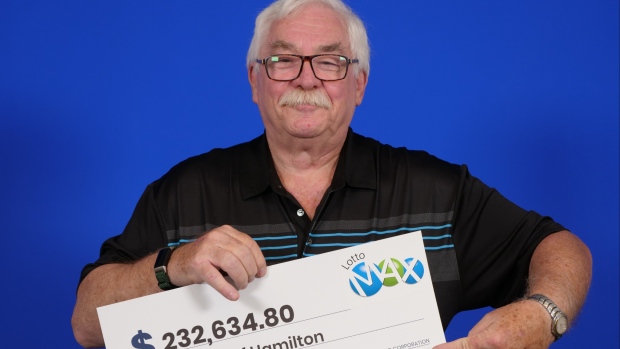 John Hamilton, of Hamilton, Ont., with his Lotto Max prize. (OLG)