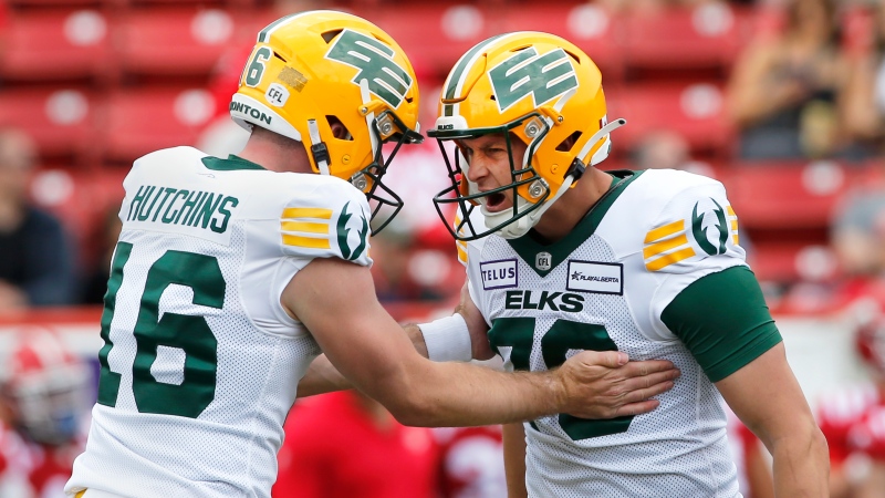 Edmonton Eskimos kicker Dean Faithfull (70) celebrates his field goal with teammate Gregory Hutchins during first half CFL exhibition football action against the Calgary Stampeders in Calgary on Monday May 22, 2023. THE CANADIAN PRESS/Larry MacDougal