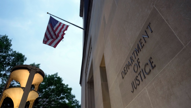 The U.S. Department of Justice is photographed late Thursday, June 8, 2023, in Washington. Former U.S. President Donald Trump says he's been indicted on charges of mishandling classified documents at his Florida estate, igniting a federal prosecution that is arguably the most perilous of multiple legal threats against the former president as he seeks to reclaim the White House. (AP Photo/Manuel Balce Ceneta)