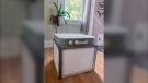 A Corsi-Rosenthal air purifier built by Liz Hradil is seen at her home in Syracuse, N.Y. after the wildfire smoke covered much of New York Wednesday, June 7, 2023. The method involves taping four air filters together with a box fan. Experts say the DIY method is highly effective against filtering air indoors against wildfire smoke. (Liz Hradil via AP)