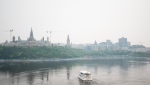 Downtown Ottawa is seen blanketed in smoke from wildfires on Monday, June 5, 2023. (THE CANADIAN PRESS/Spencer Colby)