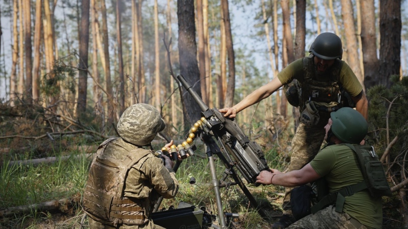 Ukrainian soldiers fire the grenade launcher towards the Russian positions on the frontline near Kreminna, Luhansk region, Ukraine, Thursday, June 8, 2023. (Roman Chop via AP)
