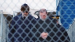 Catholic priest Eric Dejaeger is escorted by police outside an Iqaluit, Nunavut courtroom Jan. 20, 2011, after his first appearance for six child sexual abuse charges in Igloolik dating back to the 1970s. THE CANADIAN PRESS/Chris Windeyer