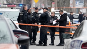 Montreal police attend the scene of a triple stabbing, in Montreal, Friday, March 17, 2023. Montreal police say a suspect is under arrest after three people were found stabbed to death inside an east-end Montreal apartment. THE CANADIAN PRESS/Ryan Remiorz