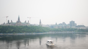 Downtown Ottawa is seen engulfed in wildfire smoke, Monday, June 5, 2023. THE CANADIAN PRESS/Spencer Colby