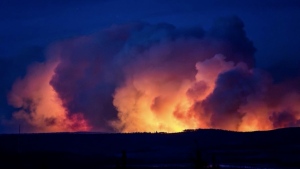 Aggressive wildfire moves closer to community