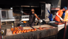 A vendor prepares ribs at Orillia's Ribfest on Fri. June 9, 2023 (Chris Garry/CTV News Barrie)