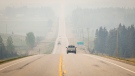 Thick smoke from wildfires blankets the landscape near Water Valley, Alta., 100 kilometres northwest of Calgary, on May 16, 2023. (THE CANADIAN PRESS/Jeff McIntosh)