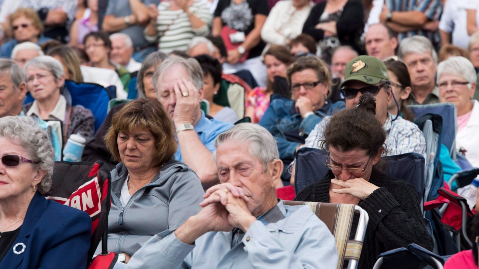 Mourners watching Lac Megantic service