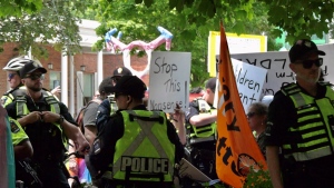 London police try to separate protestors from LGBTQ community supports in Wortley Village  on June 10,2023. (Jenn Basa/CTV News London)