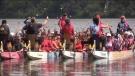 A flower ceremony was held on Fanshawe Lake as dragonboat racers honour breast cancer survivors and those who have passed away in London, Ont. on Saturday, June 10, 2023 (Brent Lale/CTV News London)
