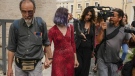 Ultima Generazione (Last Generation) activists Ester Goffi, second from left, and Guido Viero, left, arrive at The Vatican, Wednesday, May 24, 2023, where they are on trial for having staged a protest in August inside the Vatican Museums. A Vatican court on Monday, June 12, 2023, convicted the two environmental activists of aggravated damage and ordered them to pay more than 28,000 euros (US$30,000) in damages after they glued their hands to the base of an ancient statue in the Vatican Museums in a protest to draw attention to climate change. (AP Photo/Alessandra Tarantino, File)