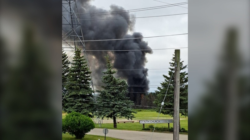 Thick black smoke billows off a fire near Highway 8 and King Street in Kitchener. (Bashar Yafouz/Facebook)