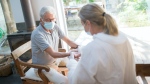 A senior patient is seen with a health-care professional in this stock photo. (Kampus Production / Pexels.com)