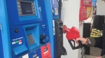 A man prepares to pump his gas in New Brunswick.