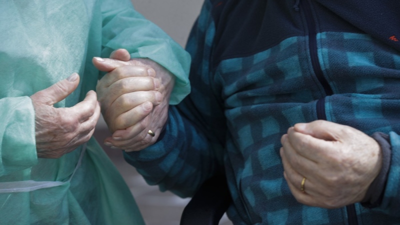 Palmiro Tami, 82, holds hand with his wife Franca Persico as the have a walk in the garden of the Fondazione Martino Zanchi nursing home, after receiving the second shot of Moderna COVID-19 Vaccine, in Alzano Lombardo, northern Italy, Monday, March 22, 2021. (AP Photo/Luca Bruno) Quebec is starting a pilot project putting geriatricians on the front line to offer better care to seniors.