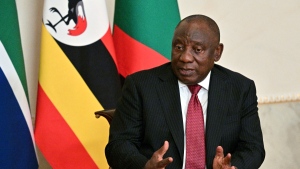 In this handout photo provided by Photo Host Agency RIA Novosti, South African President Cyril Ramaphosa gestures while speaking to Russian President Vladimir Putin, not in photo, during their talks after a meeting with a delegation of African leaders and senior officials in St. Petersburg, Russia, June 17, 2023. (Ramil Sitdikov/Photo Host Agency RIA Novosti via AP)