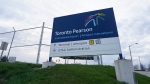 A sign for Toronto Pearson International Airport is pictured in Mississauga, Ont., on Thursday, April 20, 2023. Toronto's Pearson Airport will be home to Ontario's first public hydrogen refuelling station. THE CANADIAN PRESS/Arlyn McAdorey