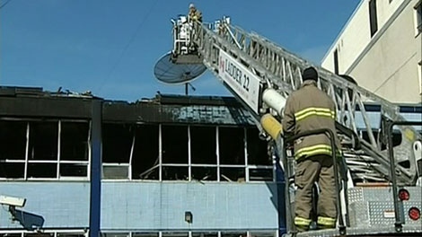 Fire officials attend the scene of a fire that gutted CTV Ottawa's newsroom over the weekend.