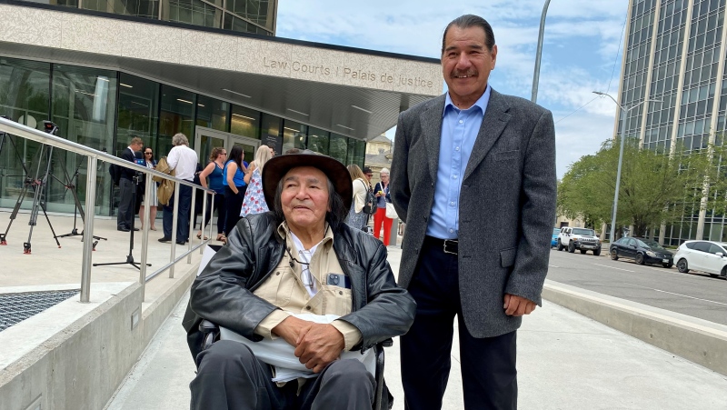 Allan Woodhouse (left) and Brian Anderson pose for a photo outside of the Manitoba law courts on July 18, 2023. The pair, who were originally convicted of killing a restaurant worker in Winnipeg in 1973, were acquitted after a new trial was ordered the previous month. (Image source: Jon Hendricks/CTV News Winnipeg)